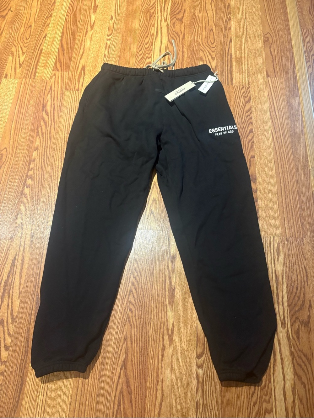 ESSENTIALS Men’s Black Sweatpants – Fear of God Logo